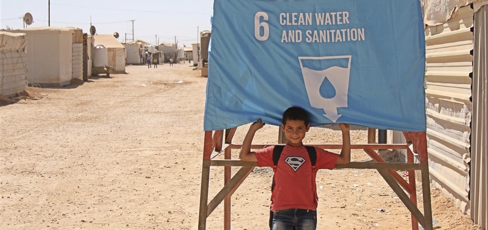 Global-Goals-A-Child-raises-a-flag-in-Jordan-1.jpg